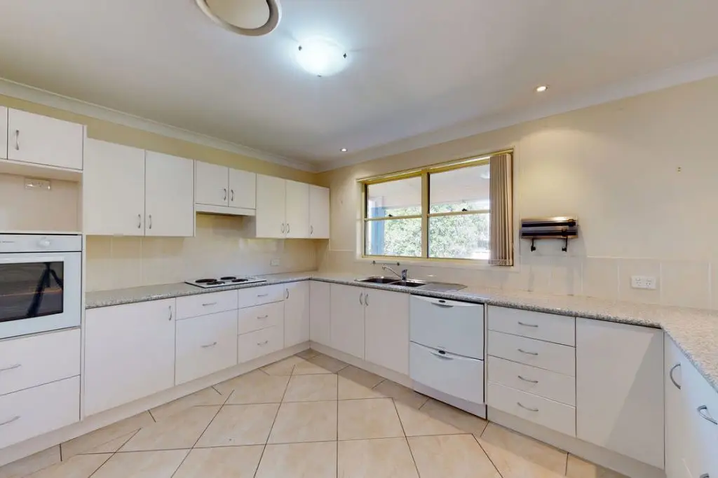 Interior view of a kitchen in Rutherford, NSW, ILO offering for a female household.